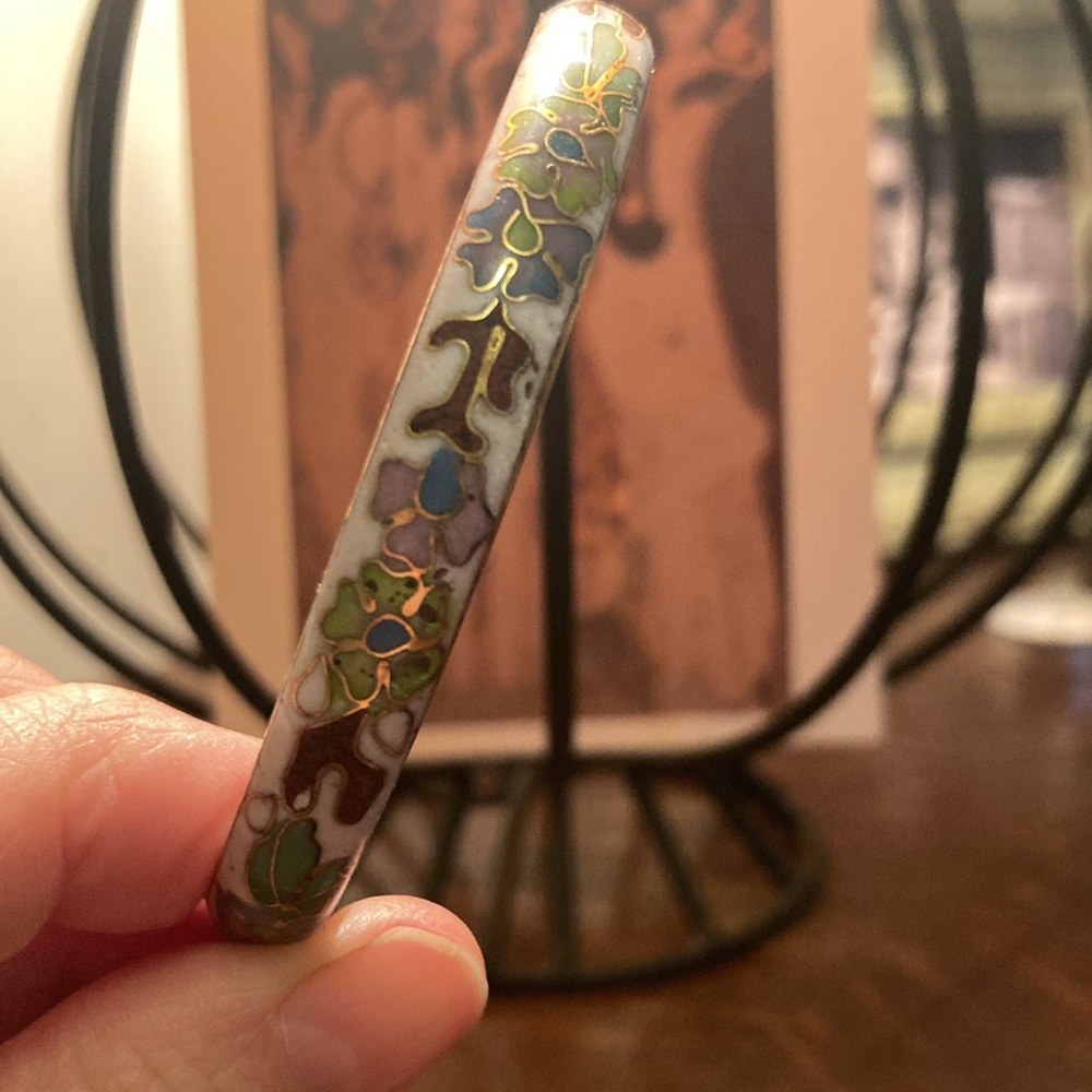 Double sided cloisonné bangle. Vintage milk white with floral brass decoration.